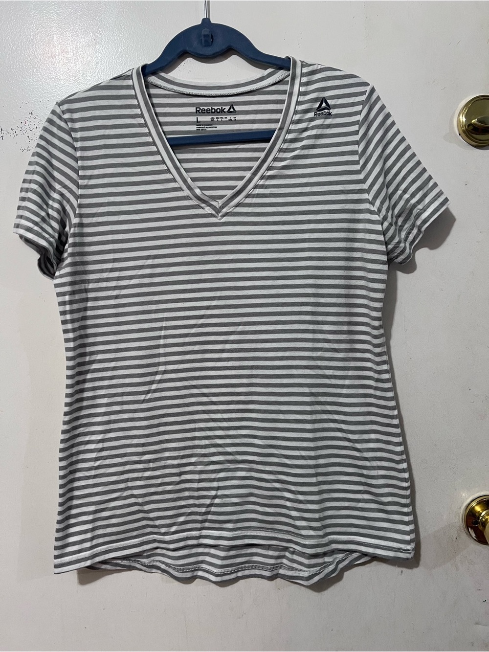 Reebok Women’s Gray and White Striped V-Neck Tee